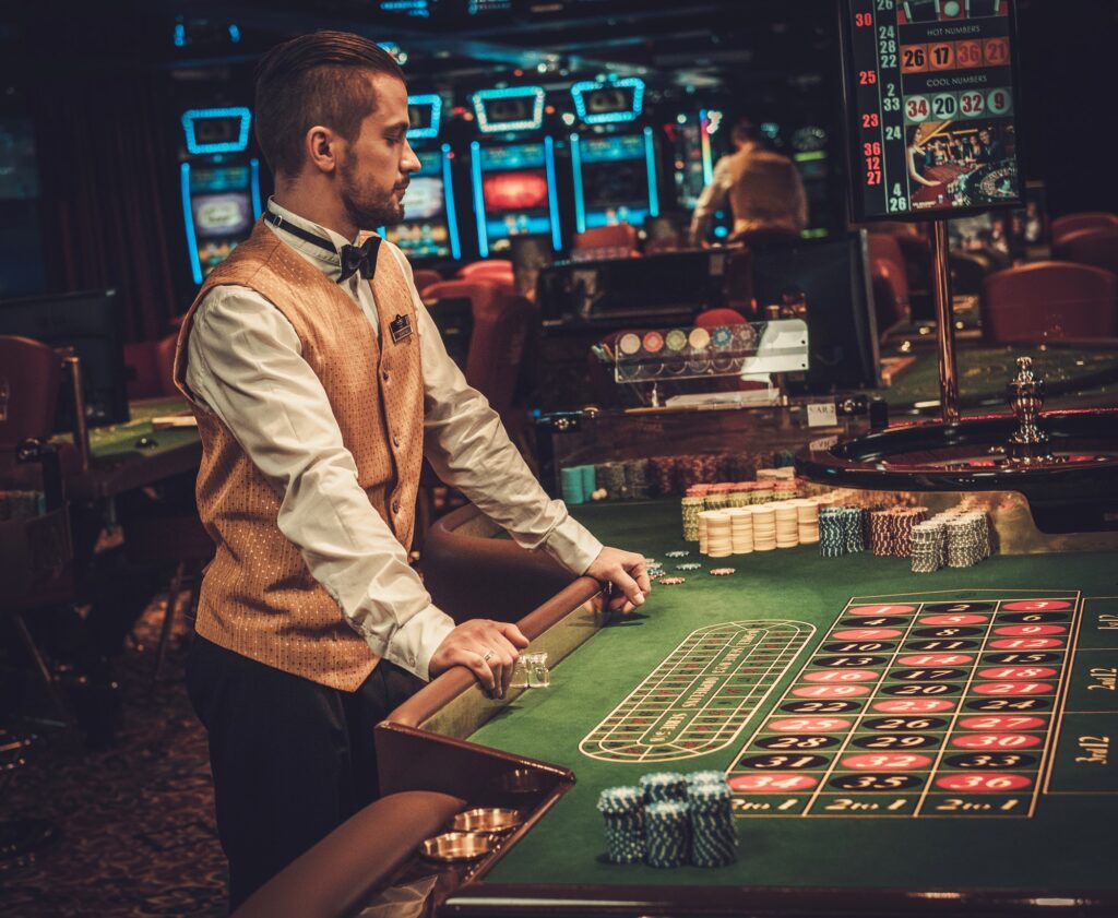 Dealer behind table in a casino