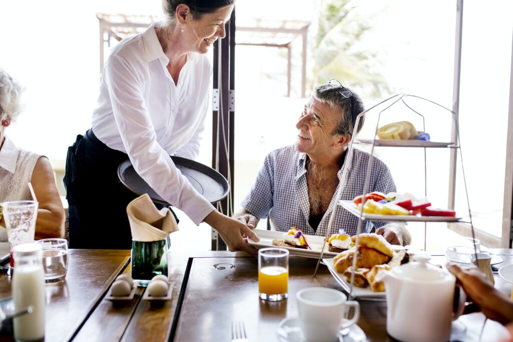 Hotel waitress serving food