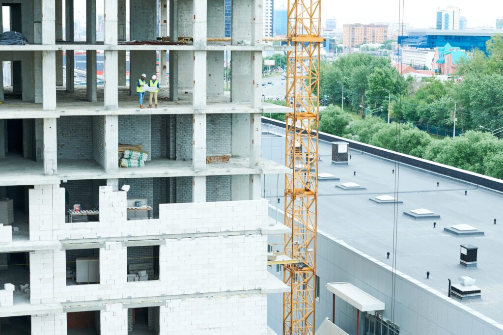 View of engineers in unfinished building