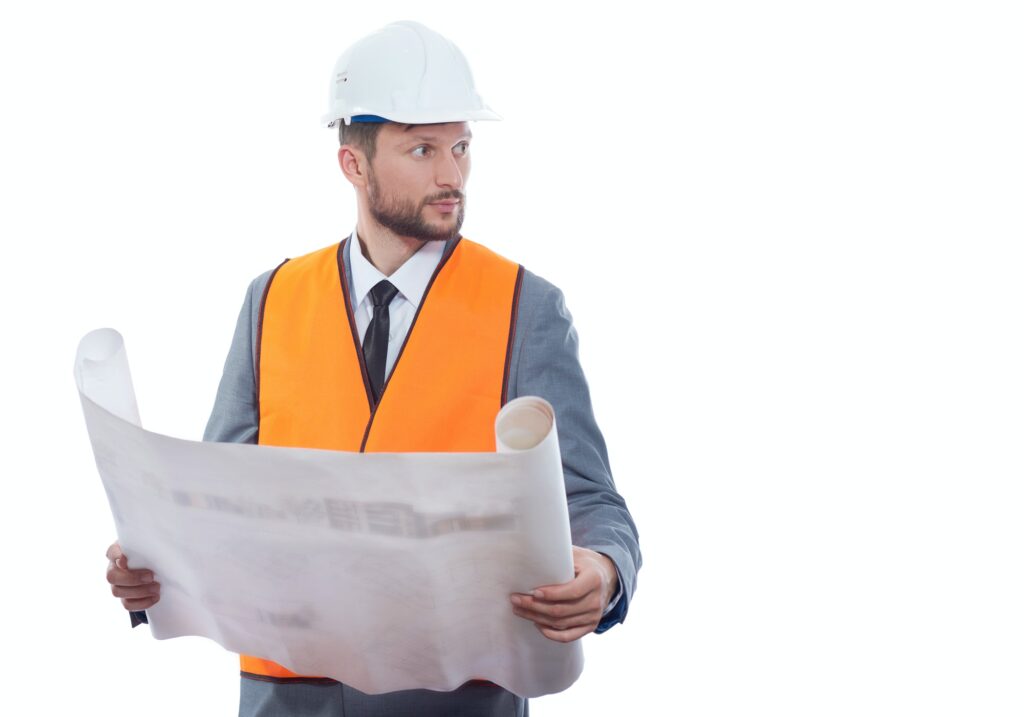 Engineer in orange vest reading drawing plan