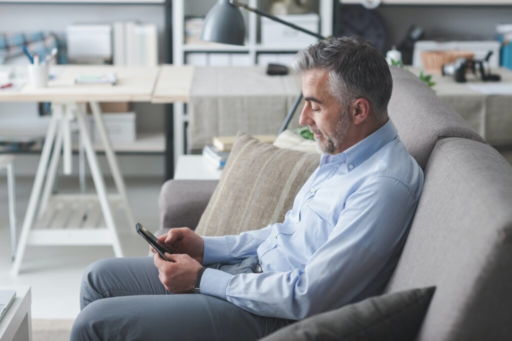 Businessman texting with his smartphone